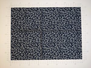 A light fabric with plants pattern, white on navy (ID: FL039)